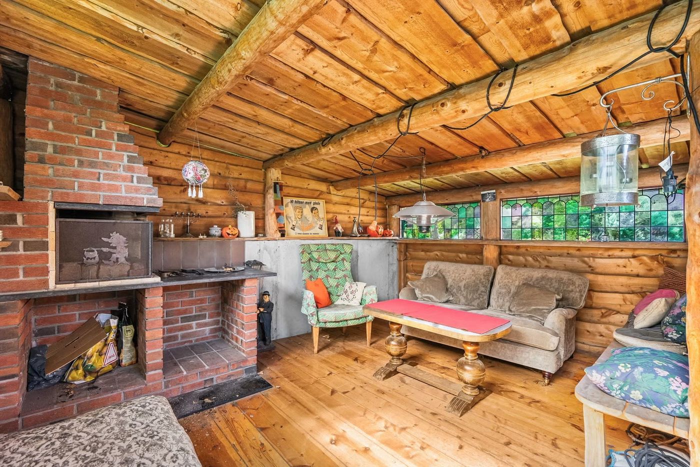 Timber walls and the brick fireplace